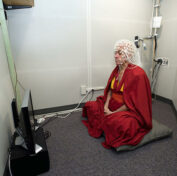 To go with Nepal-France-religion-Buddhism-philosophy,FEATURE by Frankie Taggart This handout photograph released by the University of Wisconsin-Madison on September 29, 2012, shows Buddhist monk Matthieu Ricard sitting in a soundproof room and preparing for an electroencephalography (EEG) test at the EEG facility in the Waisman Center at the University of Wisconsin-Madison in Madison on June 5, 2008. As he grins serenely and his burgundy robes billow in the fresh Himalayan wind, it is not difficult to see why scientists declared Matthieu Ricard the happiest man they had ever tested. AFP PHOTO / JEFF MILLER / UNIVERSITY OF WISCONSIN-MADISON ----EDITORS NOTE---- RESTRICTED TO EDITORIAL USE - MANDATORY CREDIT 