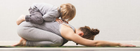 woman mom practicing yoga with her child